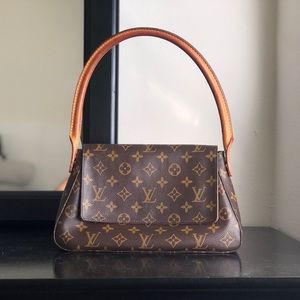 Authentic Louis Vuitton mini purse with handle